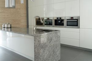 This sleek, modern style extends the countertop material down the sides of cabinets or islands, creating a continuous flow that adds elegance and sophistication.