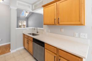 Choosing the right countertop color is essential for enhancing the beauty of natural wood cabinets.